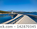 Lustica Lighthouse And Mountains Above The Blue Adriatic 142870345