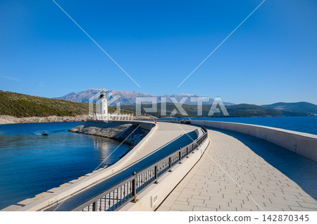 Lustica Lighthouse And Mountains Above The Blue Adriatic Lustica Lighthouse And Mountains Above The Blue Adriatic 142870345