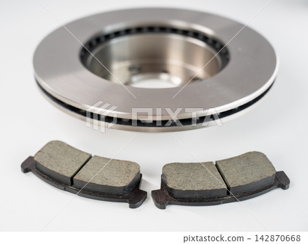 A close-up of new brake discs on a white background. A close-up of new brake discs on a white background. 142870668