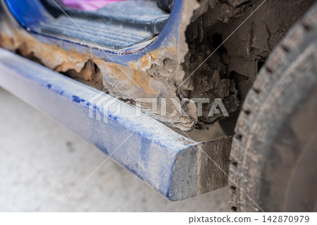 Close-up of a rusty car sill and arch. Close-up of a rusty car sill and arch. 142870979