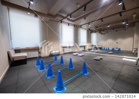 A training area with a dog trainer. A training area with a dog trainer. 142871014