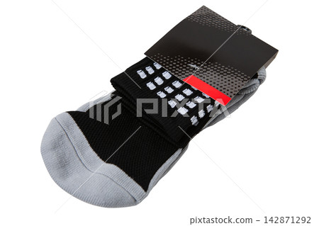 Pair of black and grey athletic socks in paper packaging isolated on white background 142871292
