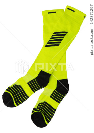 Pair of neon green and black football knee high socks isolated on white background Pair of neon green and black football knee high socks isolated on white background 142871297