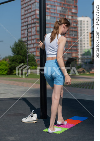 A woman with cerebral palsy walks on sensory mats. Rehabilitation A woman with cerebral palsy walks on sensory mats. Rehabilitation 142871925