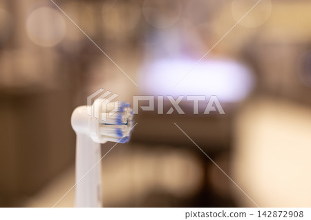 Electronic Toothbrush Head close-up on a blurry background:an innovative toothbrush Electronic Toothbrush Head close-up on a blurry background:an innovative toothbrush 142872908