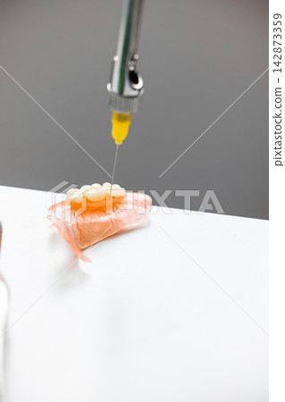 Dental prosthesis injection with carpule syringe in clinical workflow 142873359