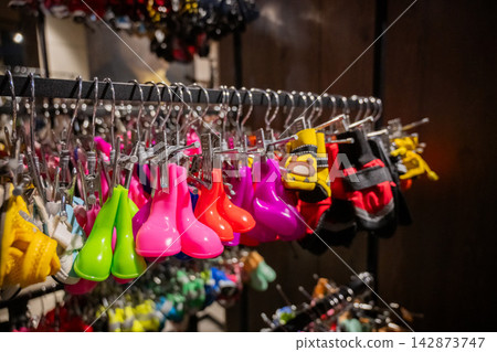 A selection of dog shoes at a pet store. A selection of dog shoes at a pet store. 142873747