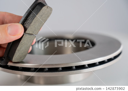 A close-up of new brake discs on a white background. 142873902