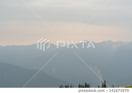 A stunning view of mountains on a rainy day from atop Hurricane Ridge. A stunning view of mountains on a rainy day from atop Hurricane Ridge. 142873970
