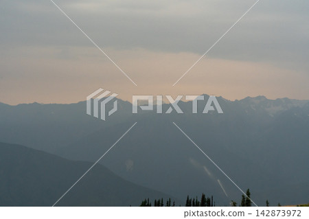 A stunning view of mountains on a rainy day from atop Hurricane Ridge. A stunning view of mountains on a rainy day from atop Hurricane Ridge. 142873972