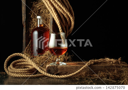 Bottle of and glass of whiskey. Bottle of and glass of whiskey. 142875070