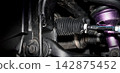 Car suspension and drive shaft. Structure of EV car spare parts. Such as Front or Rear suspension Shock absorber suspension Brake. Elements of the suspension and Chassis structure. Car service repair. 142875452