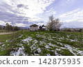 Small chapel in a rural snowy landscape, Bulgaria. 142875935
