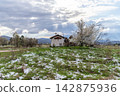 Small chapel in a rural snowy landscape, Bulgaria. 142875936
