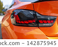 Close up of modern car illuminated rear tail light design and technology in detail 142875945
