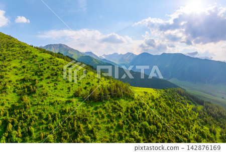 Aerial View of Lush Green Hills and Majestic Mountains Aerial View of Lush Green Hills and Majestic Mountains 142876169