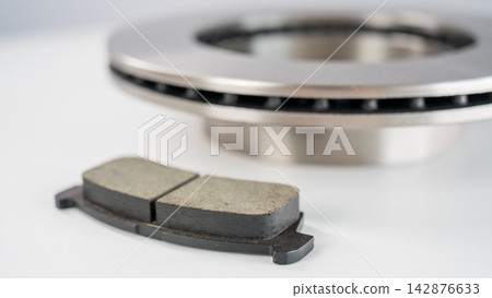 A close-up of new brake discs on a white background. A close-up of new brake discs on a white background. 142876633