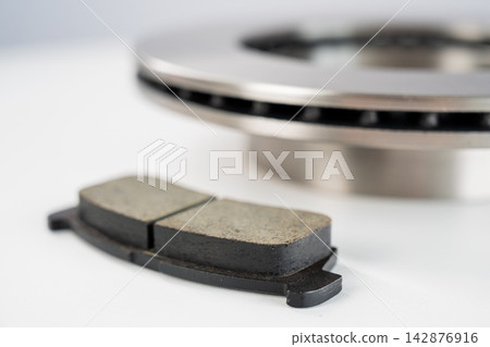 A close-up of new brake discs on a white background. A close-up of new brake discs on a white background. 142876916