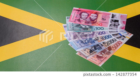 Jamaica, Jamaican paper money, dollar banknotes and cent coins for exchange. Jamaica money Jamaica, Jamaican paper money, dollar banknotes and cent coins for exchange. Jamaica money 142877354