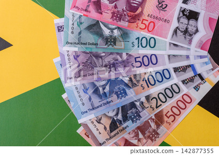Jamaica, Jamaican paper money, dollar banknotes and cent coins for exchange. Jamaica money Jamaica, Jamaican paper money, dollar banknotes and cent coins for exchange. Jamaica money 142877355