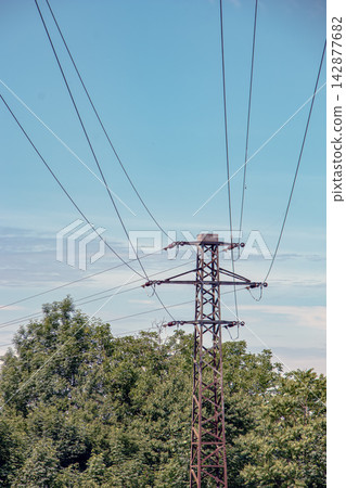 Overhead Power Lines Converging above a Metal Pylon Overhead Power Lines Converging above a Metal Pylon 142877682