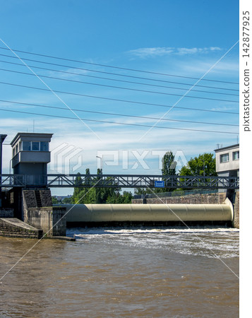 Vertical View of a Small Hydroelectric Weir and Control Buildings 142877925
