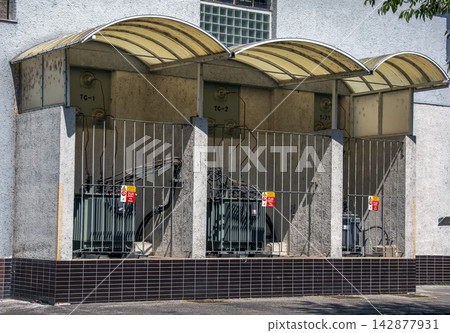 Electrical Transformers behind a Protective Fence at a Hydroelectric Facility Electrical Transformers behind a Protective Fence at a Hydroelectric Facility 142877931
