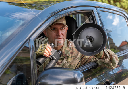 Military agent uses specialized equipment for signal interception, signals intelligence and covert collection of information about a target. Military agent uses specialized equipment for signal interception, signals intelligence and covert collection of information about a target. 142878349