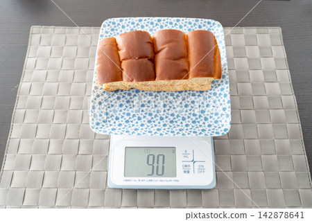 An everyday kitchen scene where brown sugar peanut sandwiches are weighed out. An everyday kitchen scene where brown sugar peanut sandwiches are weighed out. 142878641
