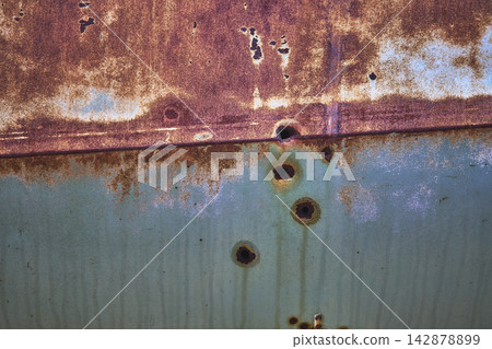 Rusty Abandoned Vehicle Texture with Bullet Holes and Faded Metal Surface Rusty Abandoned Vehicle Texture with Bullet Holes and Faded Metal Surface 142878899