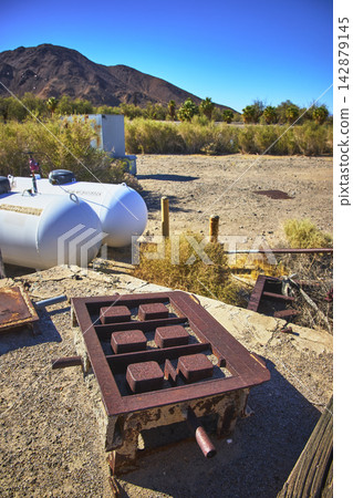 Student Group Brick Mold Propane Tanks in Mojave Desert with Mountain Backdrop, Guests of the Desert Study Center Student Group Brick Mold Propane Tanks in Mojave Desert with Mountain Backdrop, Guests of the Desert Study Center 142879145
