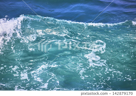 Ocean Wave Close Up With Turquoise Water And White Foam Ocean Wave Close Up With Turquoise Water And White Foam 142879170