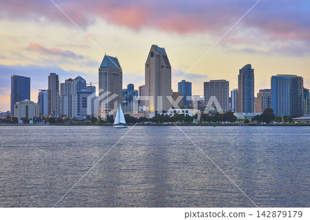 San Diego Skyline and Sailboat on Bay at Golden Hour California Waterfront View San Diego Skyline and Sailboat on Bay at Golden Hour California Waterfront View 142879179