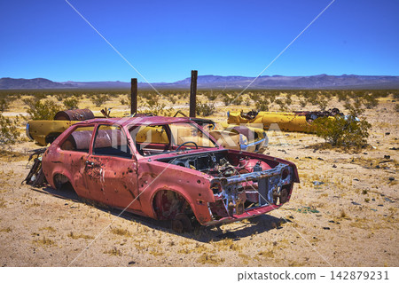 Abandoned Rusted Cars in Mojave Desert California Under Bright Sunlight 142879231