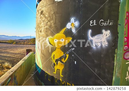 Graffiti Art on Abandoned Goldome Mill Wall With Cartoon Character and Cat in Mojave Graffiti Art on Abandoned Goldome Mill Wall With Cartoon Character and Cat in Mojave 142879258