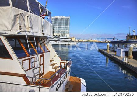 Harbor Boat Dock and Modern Hotel on Sunny San Diego Waterfront California Harbor Boat Dock and Modern Hotel on Sunny San Diego Waterfront California 142879259