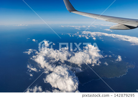 The Izu Islands as seen from outside the airplane window The Izu Islands as seen from outside the airplane window 142879295