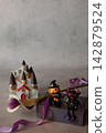 Flowers and decorations create a Halloween theme. 142879524