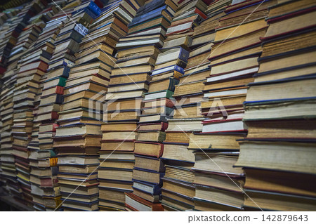 Stacks of Vintage Books Forming a Wall in a Cozy California Bookstore Stacks of Vintage Books Forming a Wall in a Cozy California Bookstore 142879643