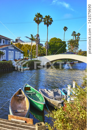 Venice Canal Historic District Boats Bridge and Palm Trees in Los Angeles California Venice Canal Historic District Boats Bridge and Palm Trees in Los Angeles California 142879690