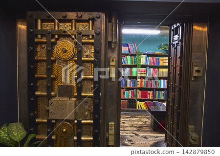 Vault Door Entrance to Colorful Bookstore Interior with Bookshelves in Los Angeles Vault Door Entrance to Colorful Bookstore Interior with Bookshelves in Los Angeles 142879850