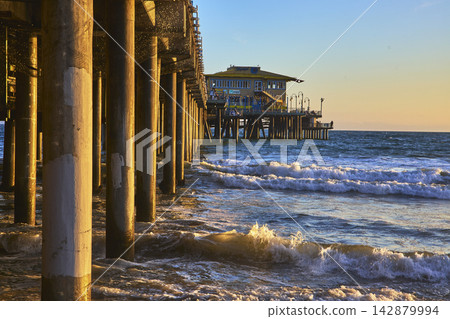 Santa Monica Pier Ocean Waves and Beach at Golden Hour California Santa Monica Pier Ocean Waves and Beach at Golden Hour California 142879994