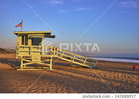 Santa Monica Lifeguard Stand on California Beach With Ocean and Golden Sunset Light Santa Monica Lifeguard Stand on California Beach With Ocean and Golden Sunset Light 142880057