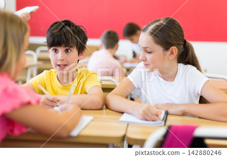 Kids doing group task 142880246