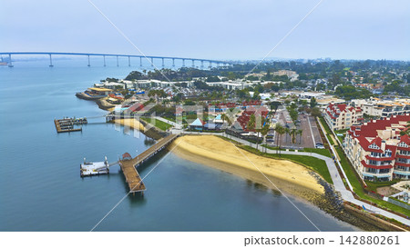 Aerial Coronado Park Pier and Dock with Waterfront and Bridge San Diego California 142880261