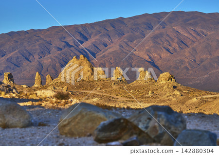 Trona Pinnacles Tufa Spires and Mountain Landscape in California at Golden Hour Trona Pinnacles Tufa Spires and Mountain Landscape in California at Golden Hour 142880304