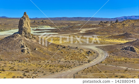 Trona Pinnacles Tufa Spire Winding Dirt Road and Desert Back Country California Trona Pinnacles Tufa Spire Winding Dirt Road and Desert Back Country California 142880345