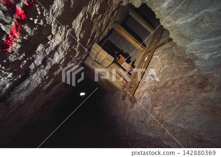 Mine Shaft Interior With Wooden Ladder And Support Structure In Nevada Mine Shaft Interior With Wooden Ladder And Support Structure In Nevada 142880369