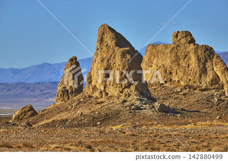 Trona Pinnacles Rugged Tufa Spires at Golden Hour in California Desert Landscape 142880499