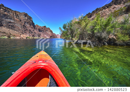 Kayak Adventure on the Colorado River with Clear Water and Rocky Canyon Views Kayak Adventure on the Colorado River with Clear Water and Rocky Canyon Views 142880523